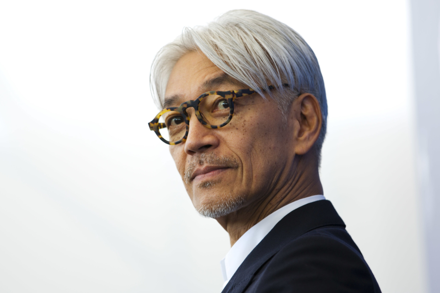 FILE - Maestro Ryuichi Sakamoto poses during a photo call for the film "Coda" at the 74th Venice Film Festival in Venice, Italy, Sept. 3, 2017. Japan's recording company Avex says Sakamoto, a musician who scored for Hollywood movies such as "The Last Emperor" and "The Revenant," has died. He was 71. He died March 28, according to the statement released Sunday, April 2, 2023.
