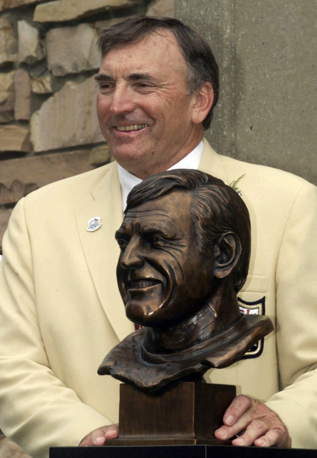FILE -Former San Francisco 49ers great Dave Wilcox poses with his bust after enshrinement into the Pro Football Hall of Fame Saturday, July 29, 2000, in Canton, Ohio. Hall of Fame linebacker Dave Wilcox, who made the Pro Bowl seven times in his 11 seasons with the San Francisco 49ers, has died. He was 80. The Pro Football Hall of Fame said Wilcox, who is also the father of California football coach Justin Wilcox, died on Wednesday, April 19, 2023.