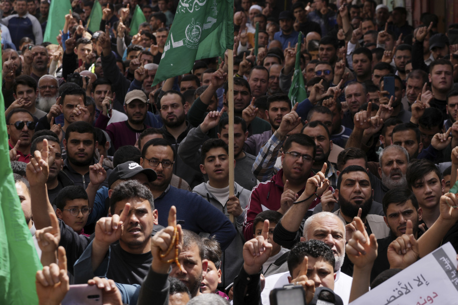 Hamas supporters chant slogans during a protest to show the solidarity with Al-Aqsa Mosque and against the Israeli police raids at the Al-Aqsa Mosque in recent days that triggered unrest in Jerusalem, after the Friday prayers on the Muslims holy month of Ramadan, in Jebaliya City, northern Gaza Strip, Friday, April 7, 2023.