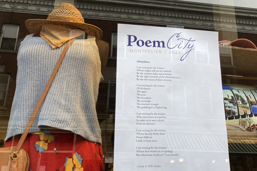 A poem is adhered to a storefront window April 1 in Montpelier, Vt.