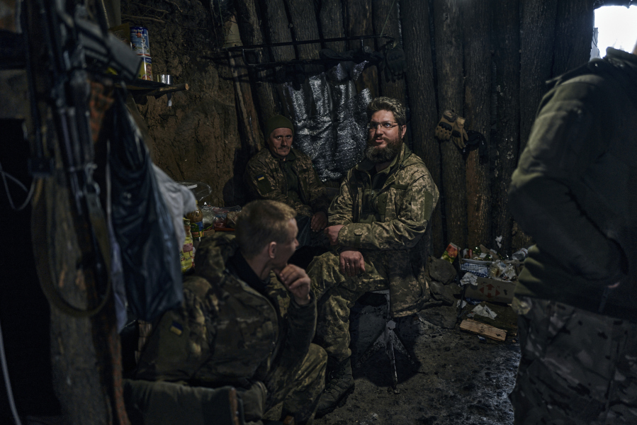 Ukrainian soldiers have a short rest in a shelter on the frontline in Bakhmut, Donetsk region, Ukraine, Sunday, April 23, 2023.