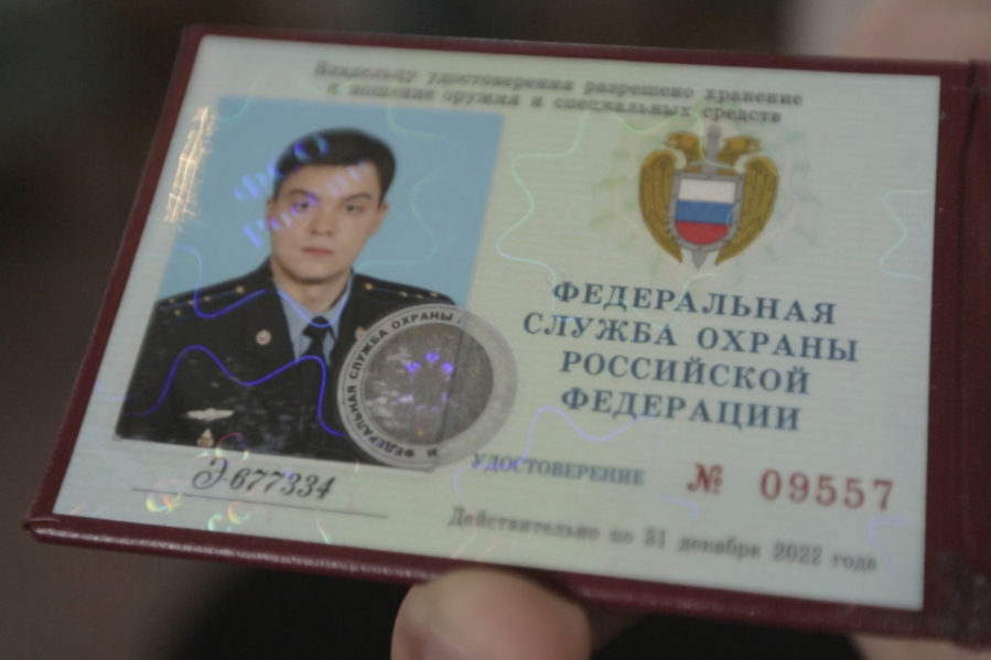 This photo provided by the Dossier Center shows the Russian Federal Protective Service (FSO) identification card of Gleb Karakulov, in October 2022 in Turkey. As an engineer in a field unit of the presidential communications department of the FSO, Karakulov was responsible for setting up secure communications for the Russian president and prime minister wherever they went.