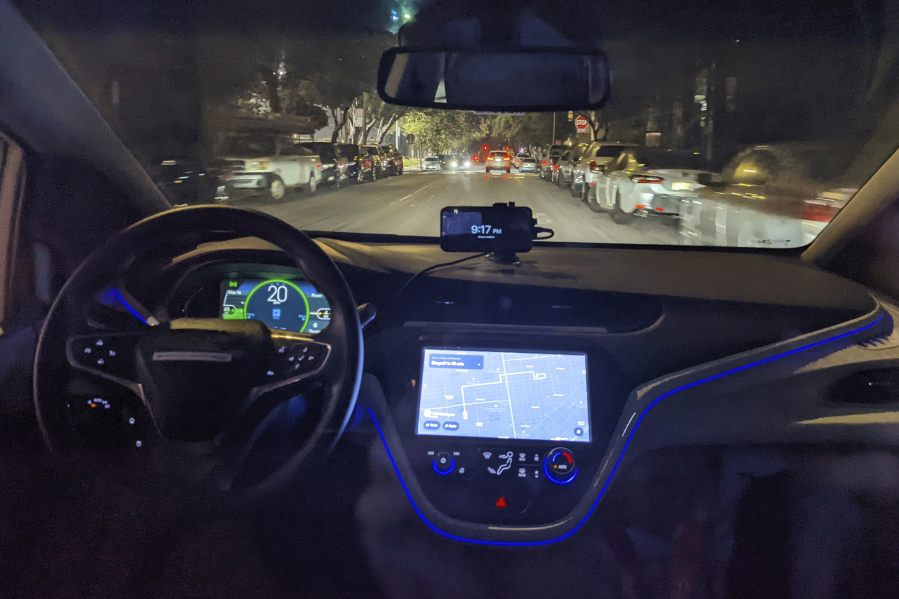 The empty driver's seat is shown in a driverless Chevy Bolt car named Peaches carrying Associated Press reporter Michael Liedtke during a ride in San Francisco on Tuesday, Sept.13, 2022. The experience provided a snapshot of the artificial intelligence technology that is advancing toward a goal of improving the lives of humans while still malfunctioning in potentially alarming ways.