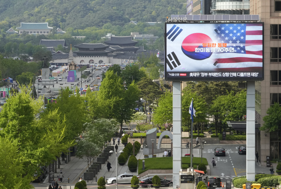 A screen shows flags of South Korea and the United States to celebrate the 70th anniversary of the South Korea-U.S. alliance in Seoul, South Korea, Wednesday, April 26, 2023. South Korean President Yoon Suk Yeol is currently visiting the United States. The letters read "Forever accompany and the 70th anniversary of the South Korea-U.S.