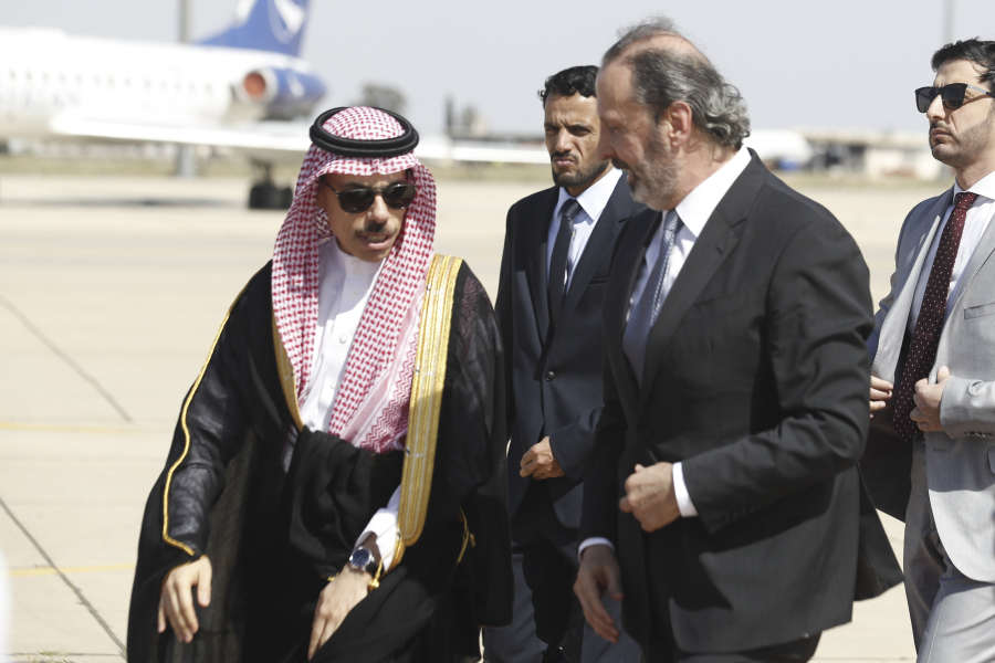 Saudi Minster of Foreign Affairs Faisal bin Farhan is escorted by the Syrian Minister of Presidential Affairs Mansour Azzam upon his arrival at Damascus airport Tuesday, April 18, 2023.