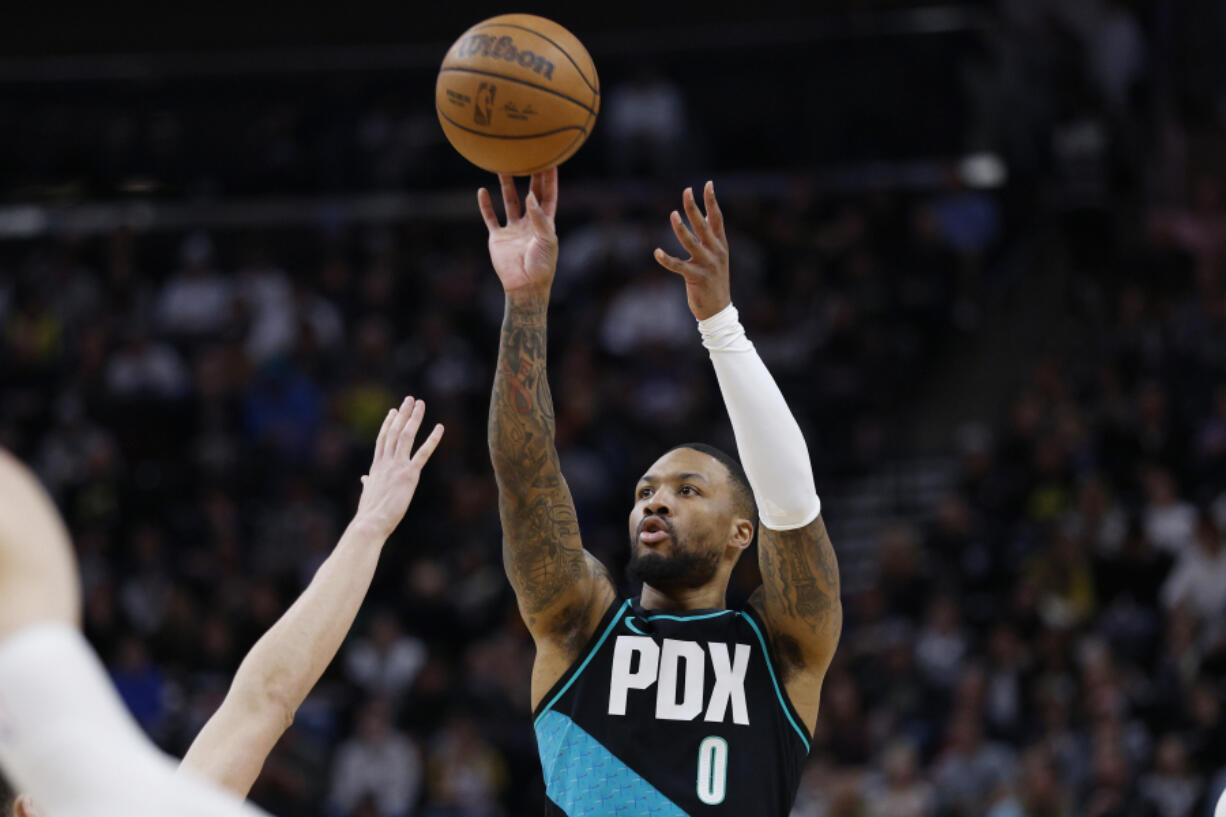 Portland Trail Blazers guard Damian Lillard (0) shoots against the Utah Jazz in the firs half during an NBA basketball game, Wednesday, March 22, 2023, in Salt Lake City.