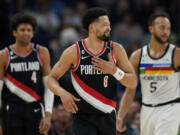 Portland Trail Blazers guard Skylar Mays (8) reacts after a Trail Blazers turnover during the first half of an NBA basketball game against the Minnesota Timberwolves, Sunday, April 2, 2023, in Minneapolis.