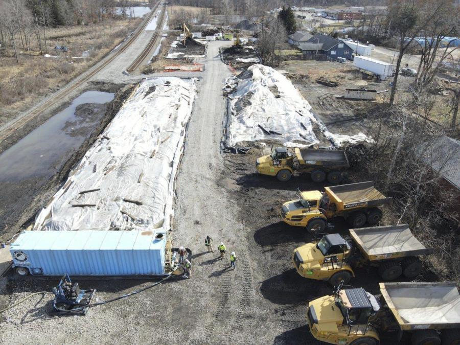 This photo released March 10, 2023, by the Ohio governor's office, shows covered piles of soils contaminated with vinyl chloride after a February train derailment in East Palestine, Ohio. Shipments of the tainted soils and liquids to treatment and storage facilities in other states have drawn protests in communities receiving the waste, but federal officials say the facilities regularly take similar wastes from elsewhere.