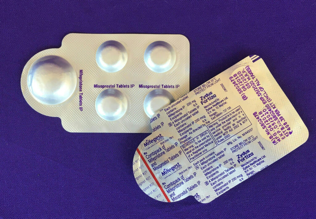 A combination pack of mifepristone, left, and misoprostol tablets, two medicines used together, also called the abortion pill.