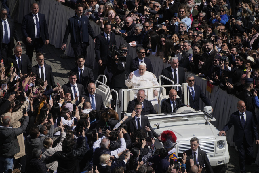 Pope Francis on the popemobile blesses the faithful in St. Peter's Square at The Vatican at the end of the Easter Sunday mass, Sunday, April 9, 2023.