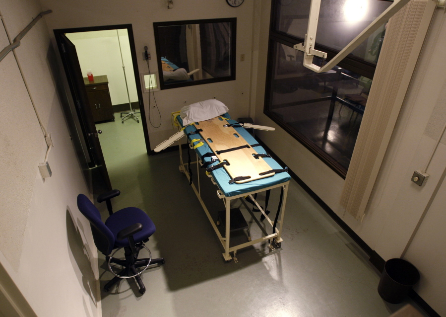 In this Nov. 20, 2008, file photo, the execution chamber at the Washington State Penitentiary is shown with the witness gallery behind glass, at right, in Walla Walla. Gov. Jay Inslee has signed Senate Bill 5087, which officially abolishes the death penalty in Washington. (AP Photo/Ted S.