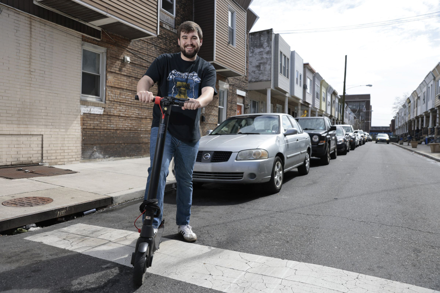 Gabe Shertz on a shared scooter near his South Philadelphia home.