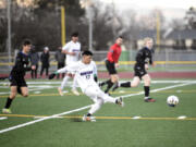 Heritage's Mijail Cusitito Cueva (17) sends a pass forward against Mountain View on April 11. The Timberwolves earned their first 3A GSHL title in program history Monday.