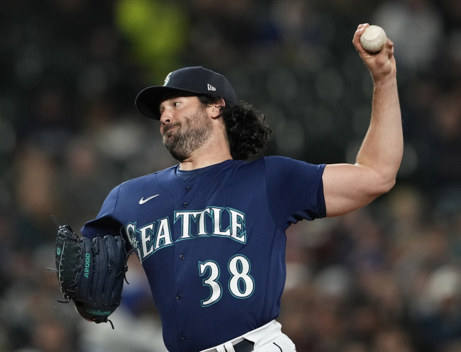 Seattle Mariners starting pitcher Robbie Ray throws against the Cleveland Guardians during the first inning of a baseball game Friday, March 31, 2023, in Seattle.