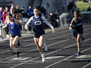 Skyview’s Dea Covarrubias (center), shown here running the 100 meters at the John Ingram Twilight Invitational track and field meet in April, won the District 4 4A 100 meters on Wednesday at McKenzie Stadium.