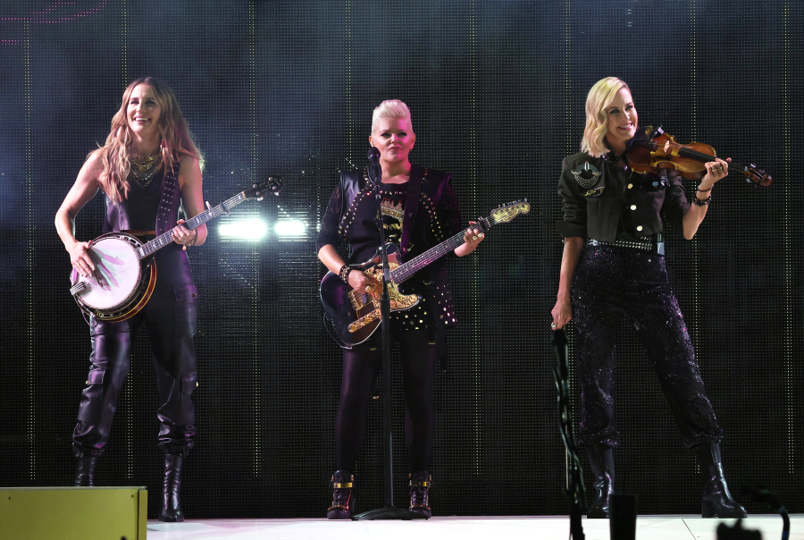 From left, Emily Strayer, Natalie Maines and Martie Maguire of the Chicks perform July 2 at Northwell Health at Jones Beach Theater in Wantagh, N.Y.