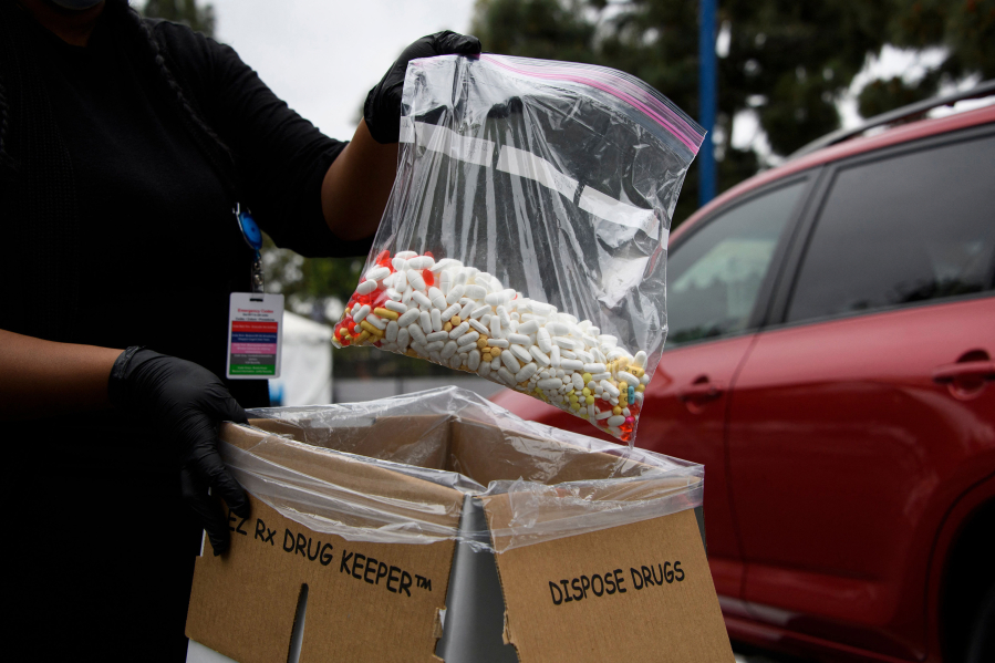 In this file photo, a bag of assorted pills and prescription drugs dropped off for disposal is displayed during the Drug Enforcement Administration (DEA) 20th National Prescription Drug Take Back Day on Apr. 24, 2021, in Los Angeles. (Patrick T.