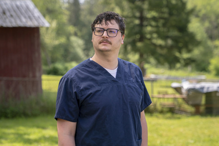 Trevor Gjendem poses for a portrait at his home in Stanwood, Washington on May 16, 2023. Gjendem, a nurse who works at Providence Regional Medical Center Everett, has been vocal about labor issues for nurses at the hospital.