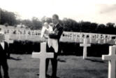 John Reynolds, a 1942 Camas High graduate, holds his infant daughter, Christina, while visiting his brother Arthur Reynolds' gravesite at the Cambridge American Cemetery and Memorial in Coton, England. Arthur Reynolds, also a Camas High graduate, was killed Nov. 10, 1943, during World War II.