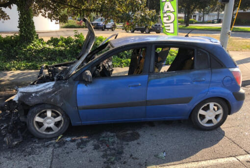 A Kia Rio after it crashed into an SUV Thursday afternoon on the St. John's Bridge in Portland and caught fire. Police say the crash pushed the SUV into the back of a pickup, and the driver of the Kia drove away from the scene.