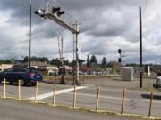 Traffic proceeds north on 32nd Street across a set of railroad tracks in Washougal.