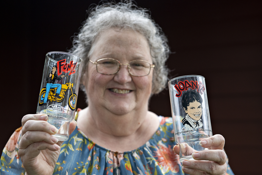 Vancouver resident Deena Fisher is attempting to raise money for her two grandchildren's college tuition by selling off her collection of thousands of promotional glasses, like these ones featuring Fonzi and Joanie from "Happy Days." The TV show aired between 1974 and 1984.