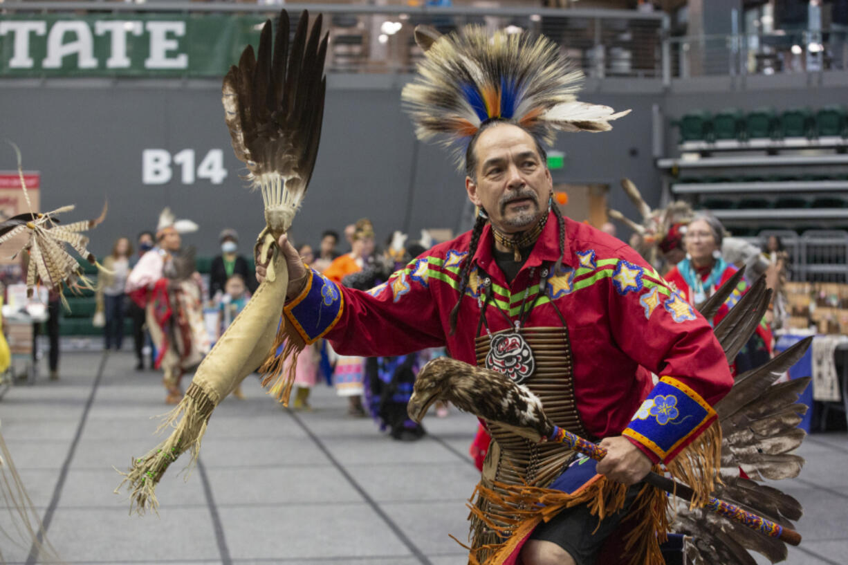 Vancouver resident Ed Wulf dances in the grand entry parade at the 50th Naimuma Powwow at Portland State University on May 6. On Saturday, he will serve as arena director at the Native American Parent Association of Southwest Washington Annual Traditional Pow-Wow at Clark College.