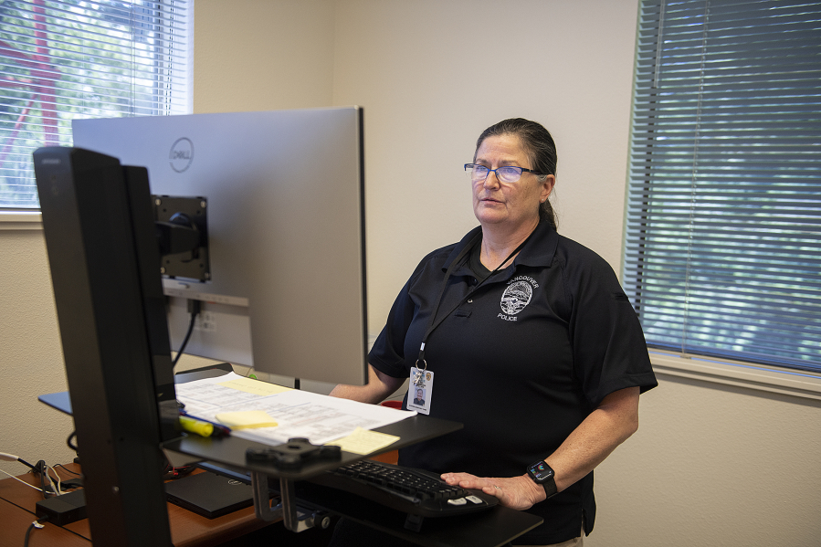 Wendi Steinbronn, interim assistant chief for the Vancouver Police Department and chief of the Washougal Police Department, tackles desk work in her Vancouver office Tuesday afternoon.