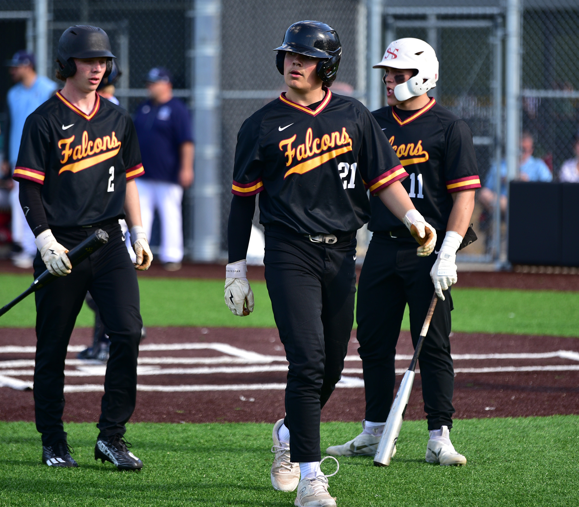 Prairie sophomore Isaac Watson, center, walks away after getting tagged out at home Tuesday, May 9, 2023, during the Falcons’ 12-4 loss to Gig Harbor in a 3A bi-district playoff game at the Evergreen Athletic Annex.