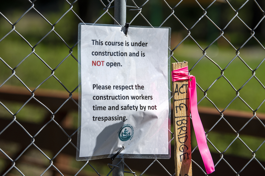 A note informs visitors not to trespass as a fence blocks access to the new disc golf course at Hockinson Meadows Community Park, which is still under construction.
