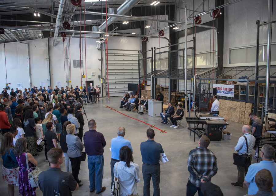 A crowd listens to Evergreen student Leslie Guel speak on Tuesday at the grand opening of the Skilled Trades Center at Evergreen High School.