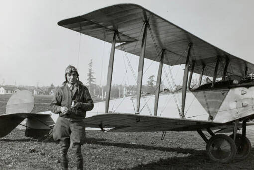 Danny Grecco poses in front of his three-seater Avro biplane in 1928. He was an ace mechanic for Tex Rankin, as well as other pilots and corporations. He helped Silas Christofferson tear down and then rebuild a Curtiss Pusher atop the Multnomah Hotel before the plane's flight to the Vancouver Barracks. He also performed in air circuses as a daredevil wing walker. When he retired, he spent time restoring airplanes at Pearson Field.