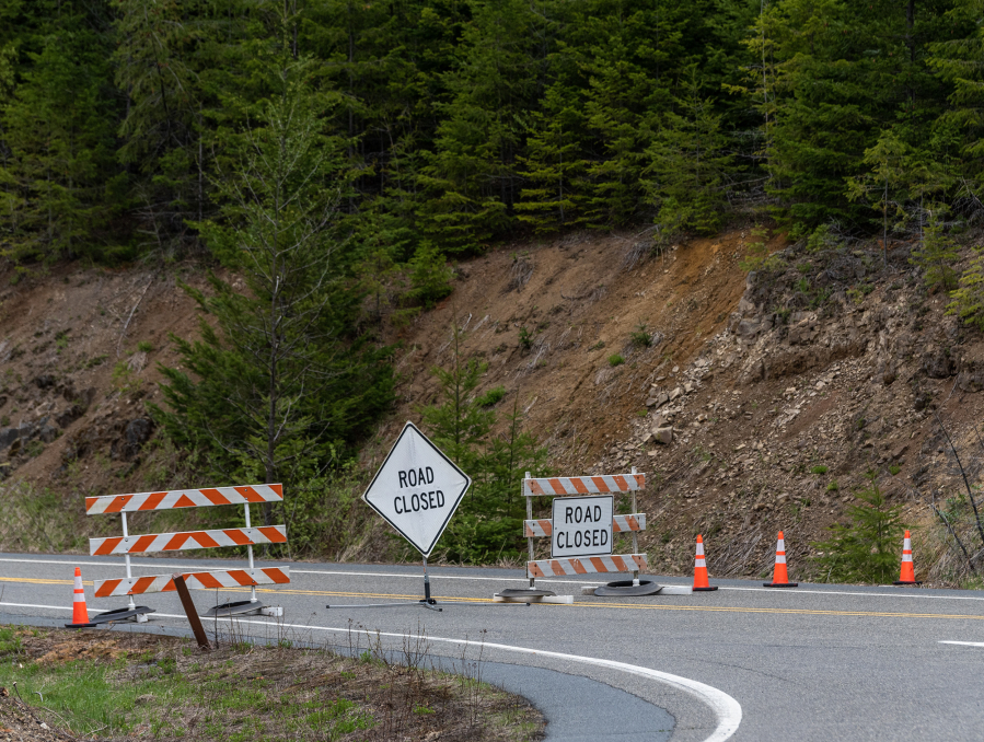 Signs tell travelers that state Highway 504 is closed, as seen Tuesday. A May 14 landslide damaged the road and its bridge near Johnston Ridge Observatory.