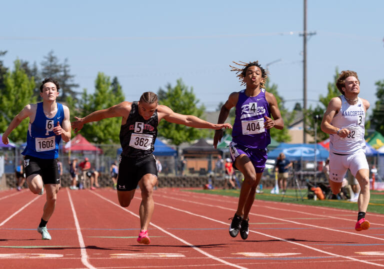 Columbia River’s Revac Banfield races across the finish in the 2A boys 100 prelims at the WIAA 2A/3A/4A State Track and Field Championships on Friday, May 26, 2023, at Mount Tahoma High School in Tacoma.