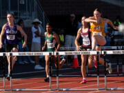 Kelso’s Josie Settle clears the final hurdle on her way to victory in the 3A girls 100-meter hurdles at the WIAA 2A/3A/4A State Track and Field Championships on Friday, May 26, 2023, at Mount Tahoma High School in Tacoma.