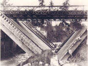 In early January 1956, heavy rains and melting snow supersaturated Clark County soil, creating landslides, washing out county roads, producing power outages and undermining the foundation of the Salmon Creek Bridge, causing it to collapse into a V-shape. The bridge failure halted Highway 99 travel in both directions until a temporary Bailey bridge from Fort Lewis restored traffic days later.
