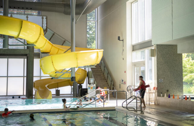 Lifeguard Keegan Amberg, right, watches over the pool at the Firstenburg Community Center in east Vancouver. The job market for teens this year is looking good, if not excellent, according to experts.