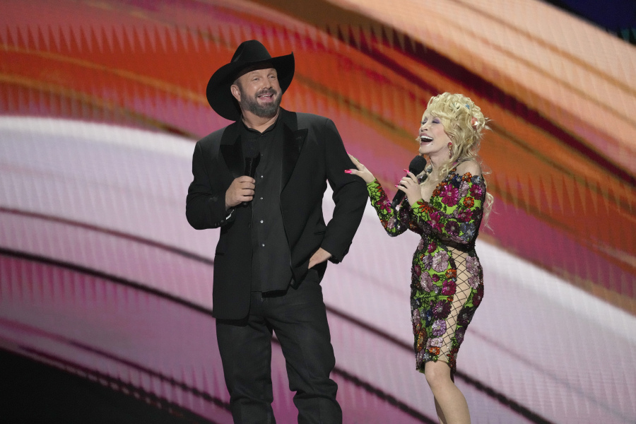 Hosts Garth Brooks, left, and Dolly Parton speak at the 58th annual Academy of Country Music Awards on Thursday, May 11, 2023, at the Ford Center in Frisco, Texas.