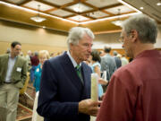 Former Congressman Don Bonker, center, and Oregon Congressman Earl Blumenauer speak after a recognition reception for the 25th anniversary of the passage of the Columbia River Gorge National Scenic Act on Aug. 13, 2011, at Skamania Lodge.