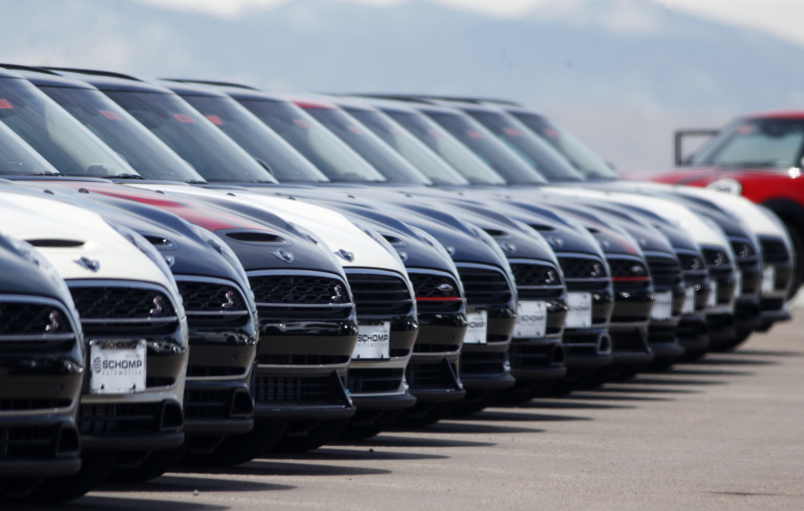 FILE - A line of unsold 2018 Cooper Clubmen sit in a long row at a Mini dealership, March 30, 2018, in Highlands Ranch, Colo. Lawmakers on Capitol Hill are pushing to keep AM radio in the nation's cars. A bipartisan group in Congress on Wednesday, May 17, 2023, introduced the "AM for Every Vehicle Act." The bill calls on the National Highway Traffic Safety Administration to require automakers to keep AM radio in new cars at no additional cost.