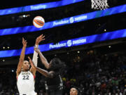 Las Vegas Aces forward A'ja Wilson (22) shoots over Seattle Storm center Ezi Magbegor (13) during the first half of a WNBA basketball game, Saturday, May 20, 2023, in Seattle.