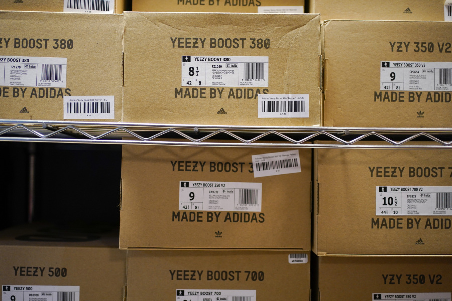 FILE - Boxes containing Yeezy shoes made by Adidas are seen at Laced Up, a sneaker resale store, in Paramus, N.J., Tuesday, Oct. 25, 2022. Adidas saw operating earnings dwindle in the first three months of the year as the German sportswear company's breakup with the rapper formerly known as Kanye West and his popular Yeezy shoe brand cost it 400 million euros ($441 million) in lost sales. Profit was down to 60 million euros from 437 million euros in the same quarter a year ago, while profit margin shrank to a bare 1.1%. Net sales declined 1%, to 5.27 billion euros, and would have risen 9% with the Yeezy line, the company said Friday, May 5, 2023.