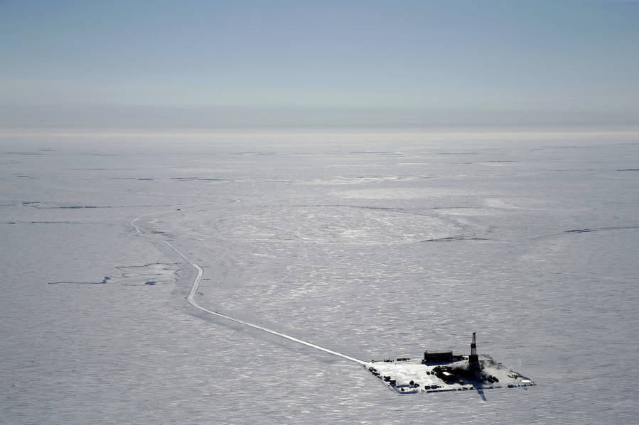FILE - This 2019 aerial photo provided by ConocoPhillips shows an exploratory drilling camp at the proposed site of the Willow oil project on Alaska's North Slope. Alaska's push to become a bigger player in the clean energy market is in the spotlight this week at a conference convened by Republican Gov. Mike Dunleavy, even as the state continues to embrace new fossil fuel production, including the controversial Willow oil project.