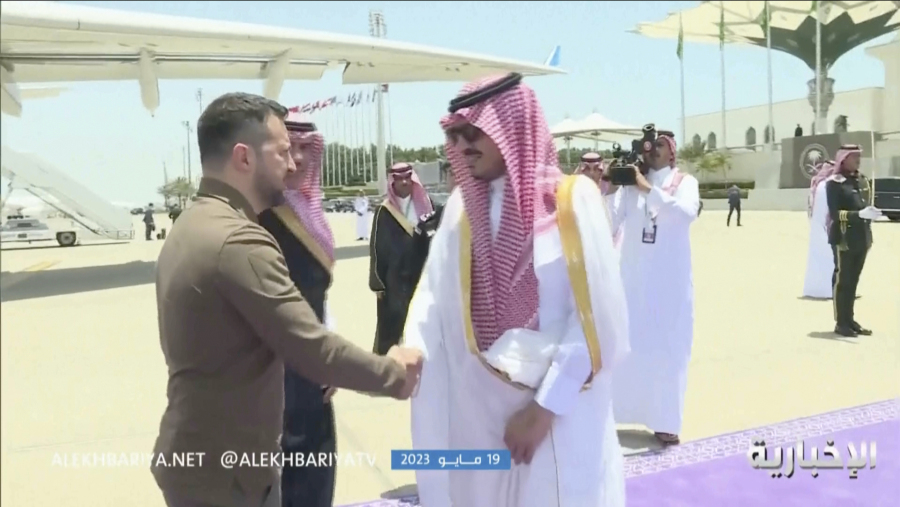 This video grab shows Ukrainian President Volodymyr Zelenskyy, left, arriving at the airport in Jeddah, Saudi Arabia, Friday May 19, 2023.