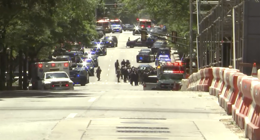 Emergency personnel respond to the scene of an active shooter in Atlanta on Wednesday, May, 3, 2023. Police said Wednesday afternoon that they were investigating an "active shooter situation" in a building in Atlanta's Midtown neighborhood and that multiple people had been injured.