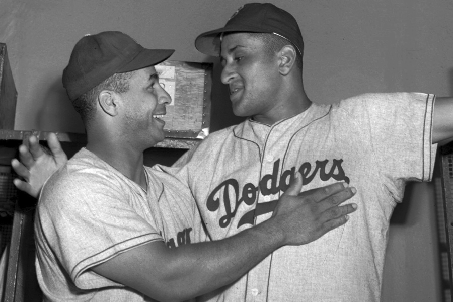 FILE - Brooklyn Dodgers catcher Roy Campanella, left, congratulates his battery mate, Don Newcombe, in the dressing room at the Polo Grounds in New York on Sept. 2, 1949. Holman Stadium in Nashua, N.H., is being recognized for hosting the country's first racially integrated baseball team, the Nashua Dodgers, in 1946. The club was a minor league league affiliate of the Dodgers, which included Hall of Famer Campanella and future Cy Young Award winner Newcombe.