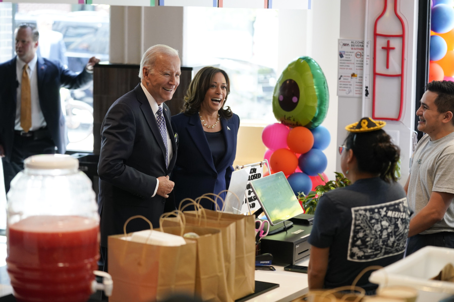 President Joe Biden and Vice President Kamala Harris arrive to pick up an order from Taqueria Habanero restaurant on Friday, May 5, 2023, in Washington.