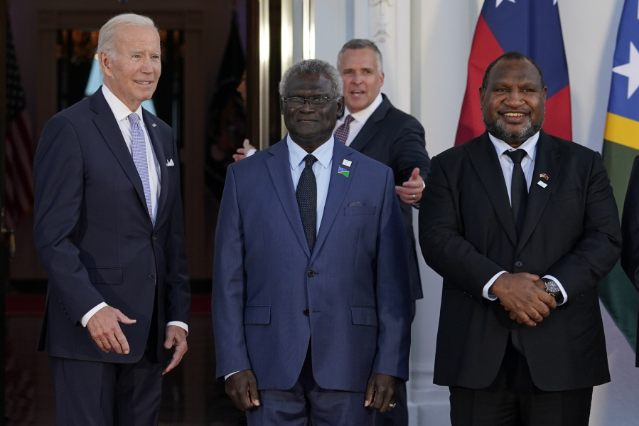 FILE - President Joe Biden poses for photos with Pacific Island leaders including Solomon Islands Prime Minister Manasseh Sogavare, center, and Papua New Guinea Prime Minister James Marape on the North Portico of the White House in Washington, Sept. 29, 2022. On Wednesday, May 17, Biden canceled a visit to Papua New Guinea planned for May 22 to focus on debt limit talks at home, disappointing many in the Pacific Island nation.