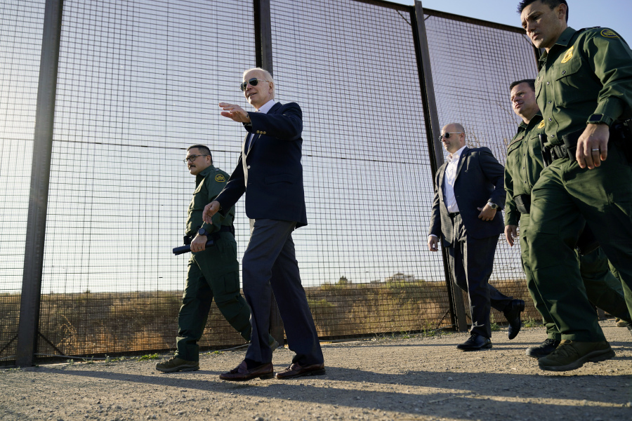 FILE - President Joe Biden walks along a stretch of the U.S.-Mexico border in El Paso Texas, Jan. 8, 2023. The Biden administration has requested 1,500 troops for the U.S.-Mexico border amid an expected migrant surge following the end of pandemic-era restrictions.
