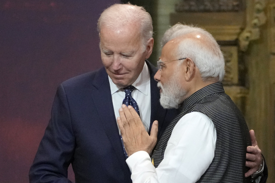 FILE - U.S. President Joe Biden, left, and India Prime Minister Narendra Modi talks during the G20 leaders summit in Nusa Dua, Bali, Indonesia, Nov. 15, 2022. Biden has made it a mission for the U.S. to build friendships overseas, and the next few weeks will offer a vivid demonstration of the importance he's placing on a relationship with Modi.